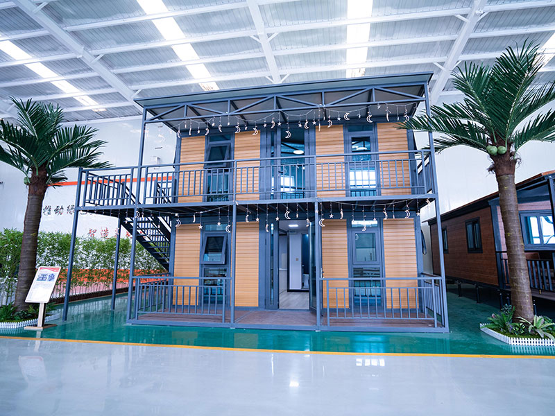 Maison modulaire extensible double face à toit plat à deux niveaux